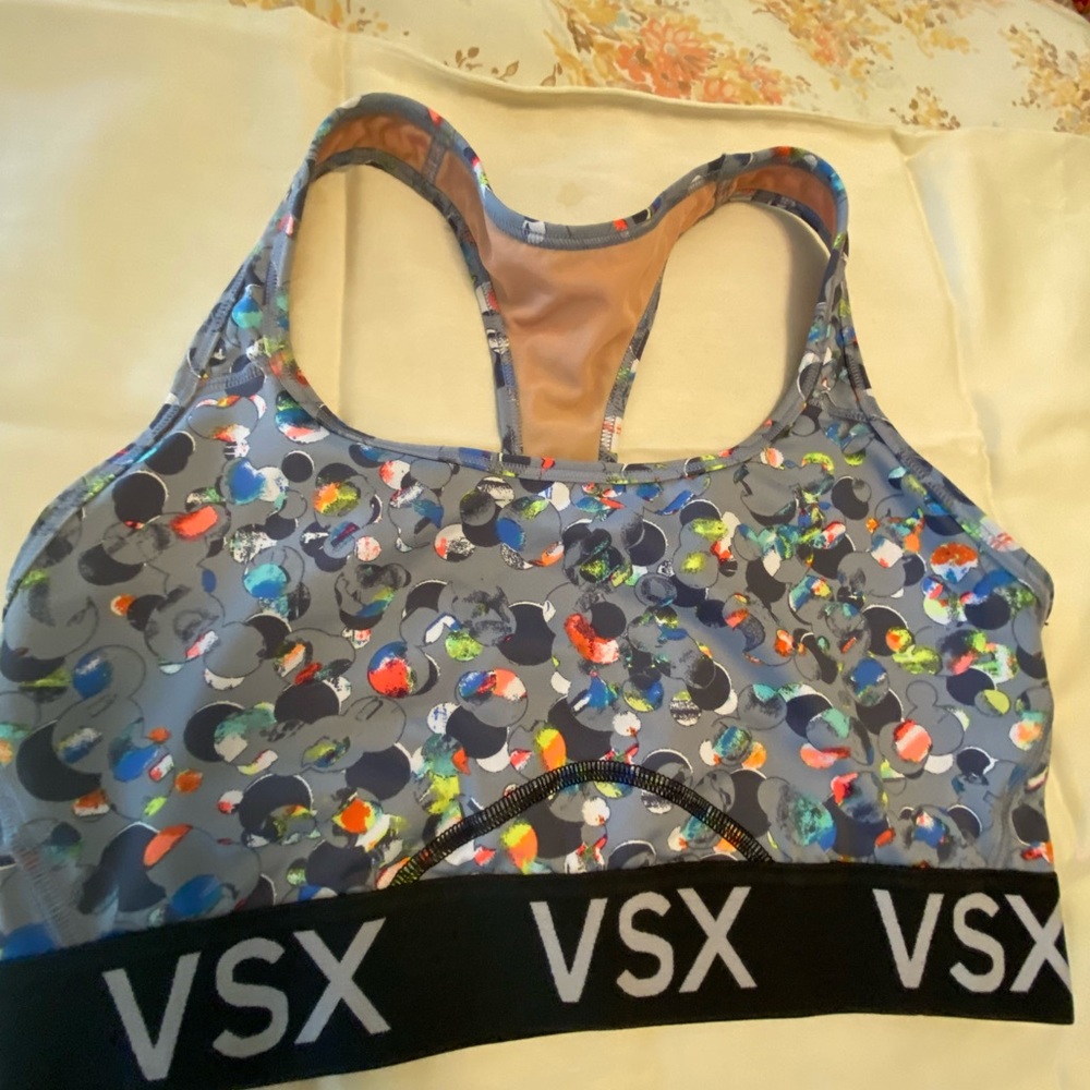 Sports bra size M by Victoria Sport.  No pads.